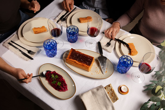 Family dining at a fancy restaurant with dessert and wine, capturing MIL&rsquo;s surprise birthday celebration expectations.