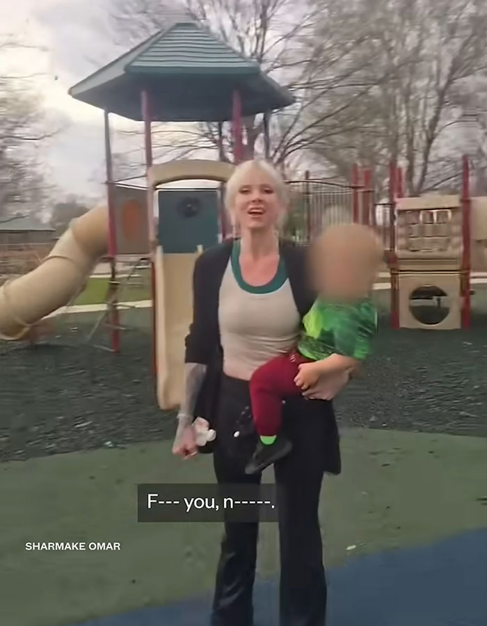 Woman at playground holding child, involved in racist incident using a racial slur, raising $500K claiming victim status