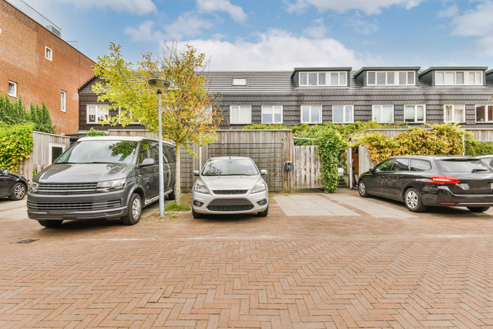 Parking dispute with entitled lady taking friendly neighbor's spot in a residential area with several parked cars and houses. Parking dispute with entitled lady taking friendly neighbor's spot in a residential area with several parked cars and houses.