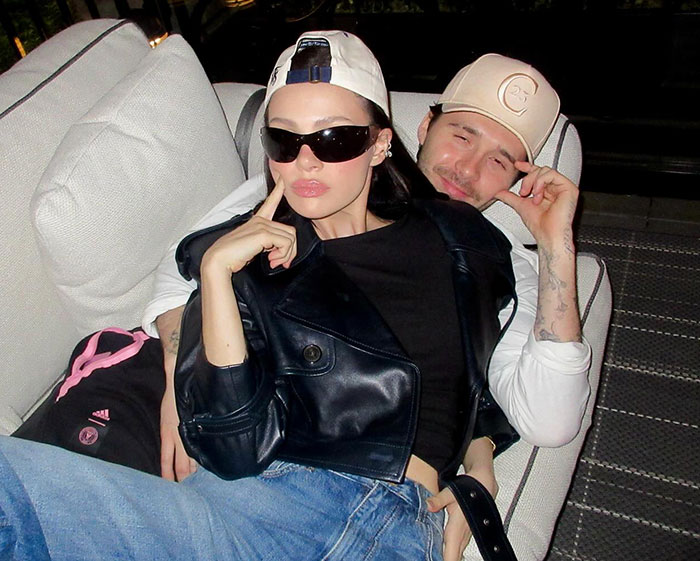 Brooklyn Beckham's ex posing casually with sunglasses and cap, responding to Nicola Peltz's toxic Beckham family claims.