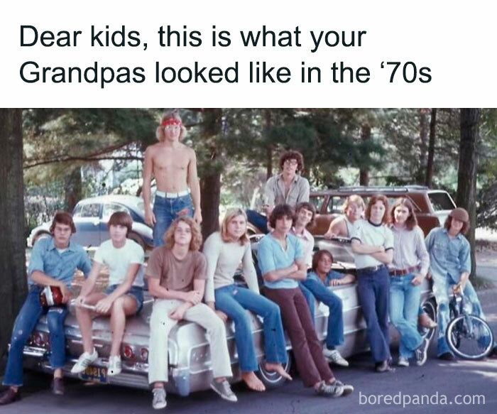 Group of teens in 70s fashion sitting on a vintage car in a nostalgic photo from the past.