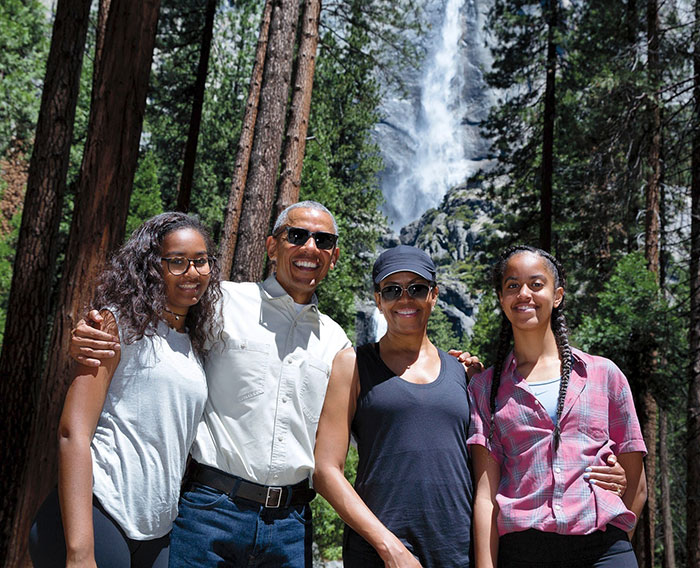 Sasha Obama and Malia standing together outdoors, showing off figure at party amid divorce rumors discussion. Sasha Obama and Malia standing together outdoors, showing off figure at party amid divorce rumors discussion.