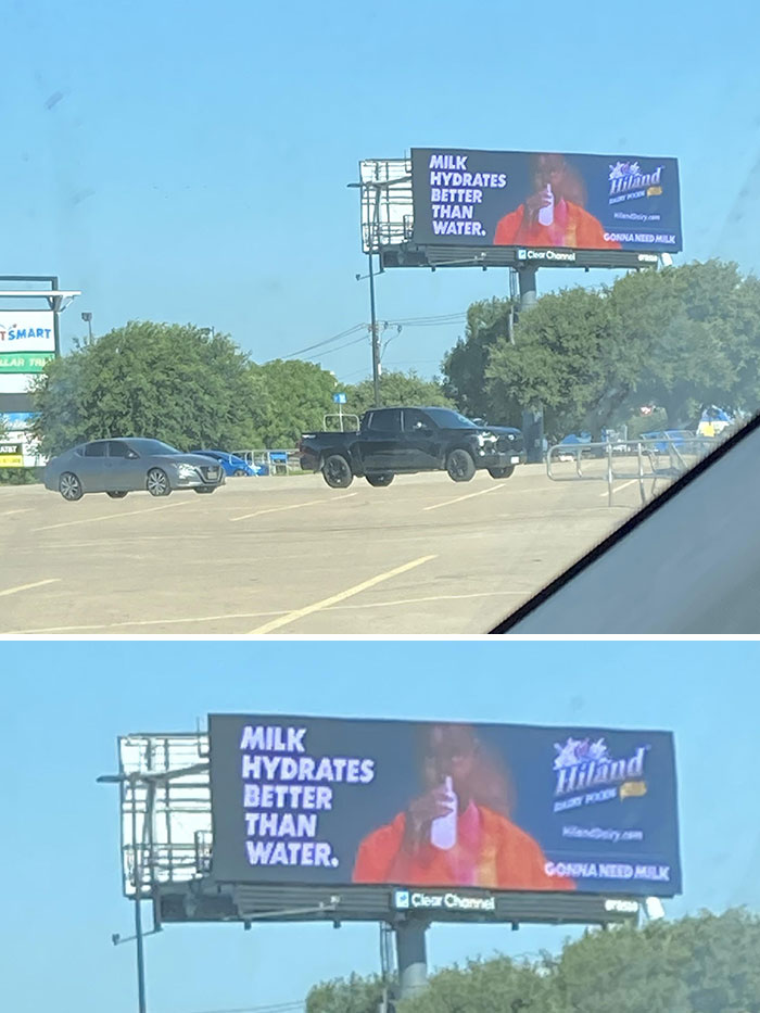 Billboard in US parking lot promoting milk hydration, capturing a moment of current life in America through everyday scenes.