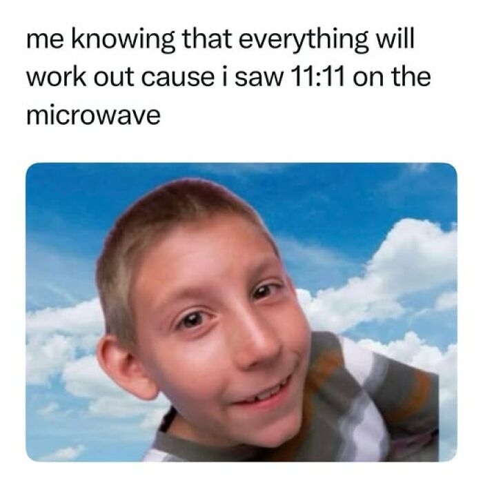 Child smiling with a sky background in a nostalgic meme about seeing 11:11 on a microwave for good luck.