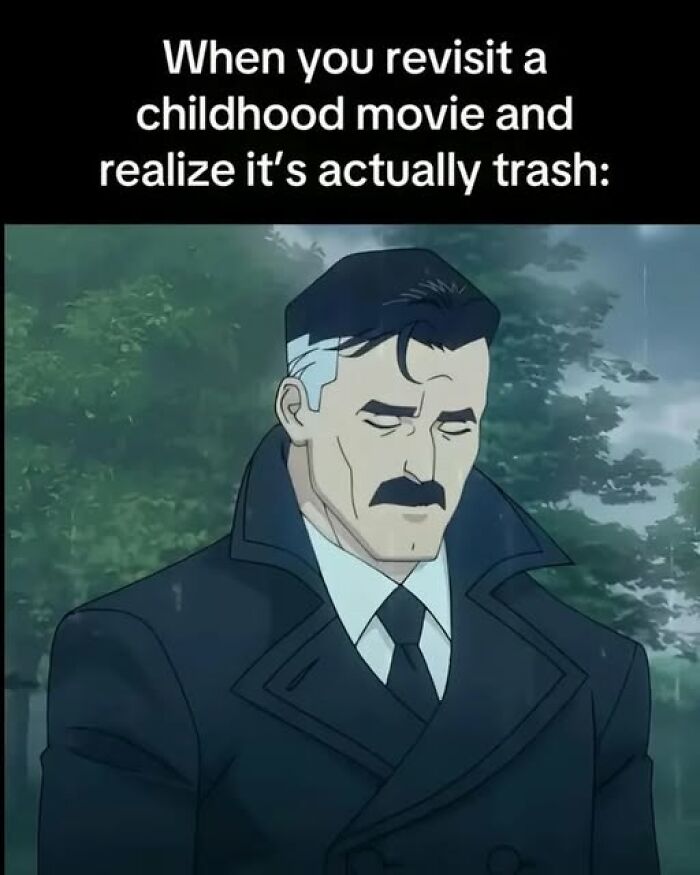 Sad animated man in a dark coat reflects on nostalgic childhood movies that turned out to be disappointing or trash.