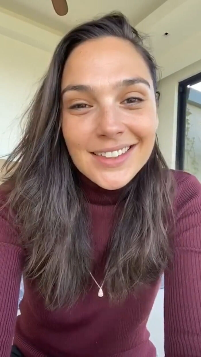 Young woman smiling in a casual setting, sharing a story about out-of-touch people getting shamed online.