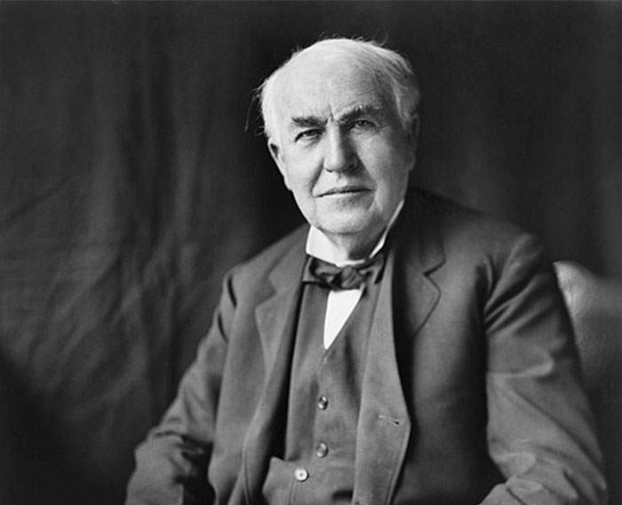 Portrait of an elderly man in a suit and bow tie, representing historical figures linked to Steve Jobs and celebrity legacy.