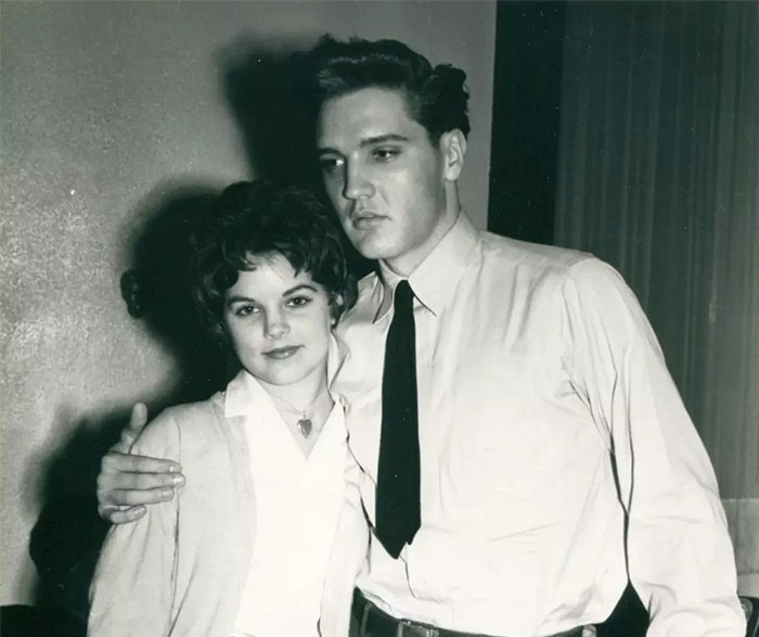 Young man and woman posing in a vintage black and white photo, evoking stories of celebrities like Steve Jobs.
