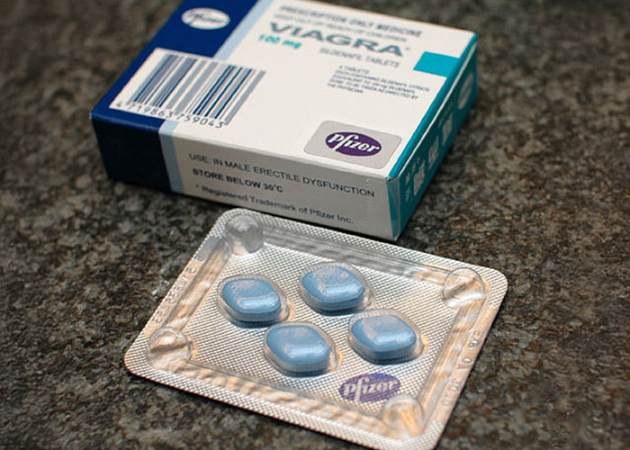 Blue Viagra pills in a blister pack next to a box, highlighting risks when patient’s lie affects treatment safety.