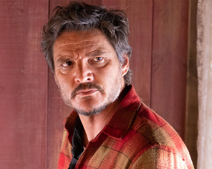Pedro Pascal with a new jawline, wearing a red plaid shirt, sparking fans guessing plastic surgery or Ozempic effects. Pedro Pascal with a new jawline, wearing a red plaid shirt, sparking fans guessing plastic surgery or Ozempic effects.