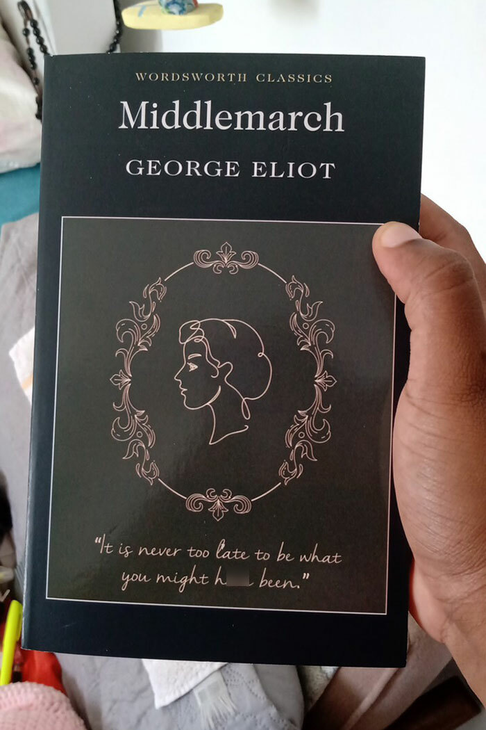 Hand holding the book Middlemarch by George Eliot, one of the excellent books recommended by readers online.