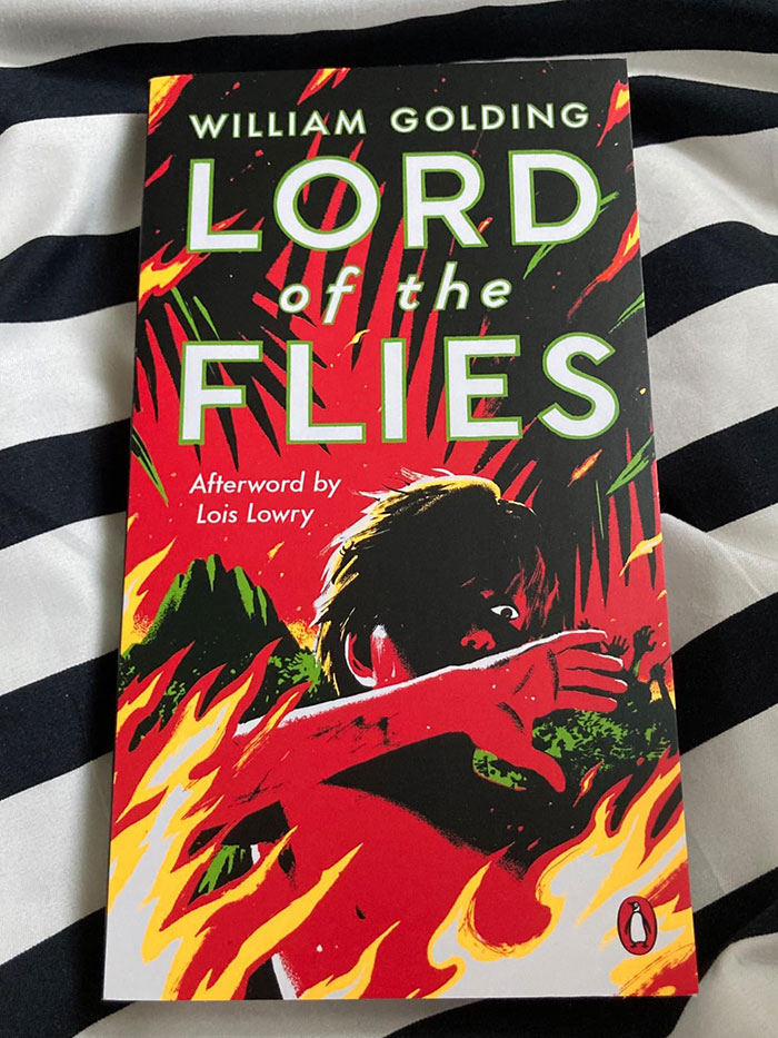 Book cover of Lord of the Flies by William Golding, an excellent book recommended by readers online with vibrant red and black design.