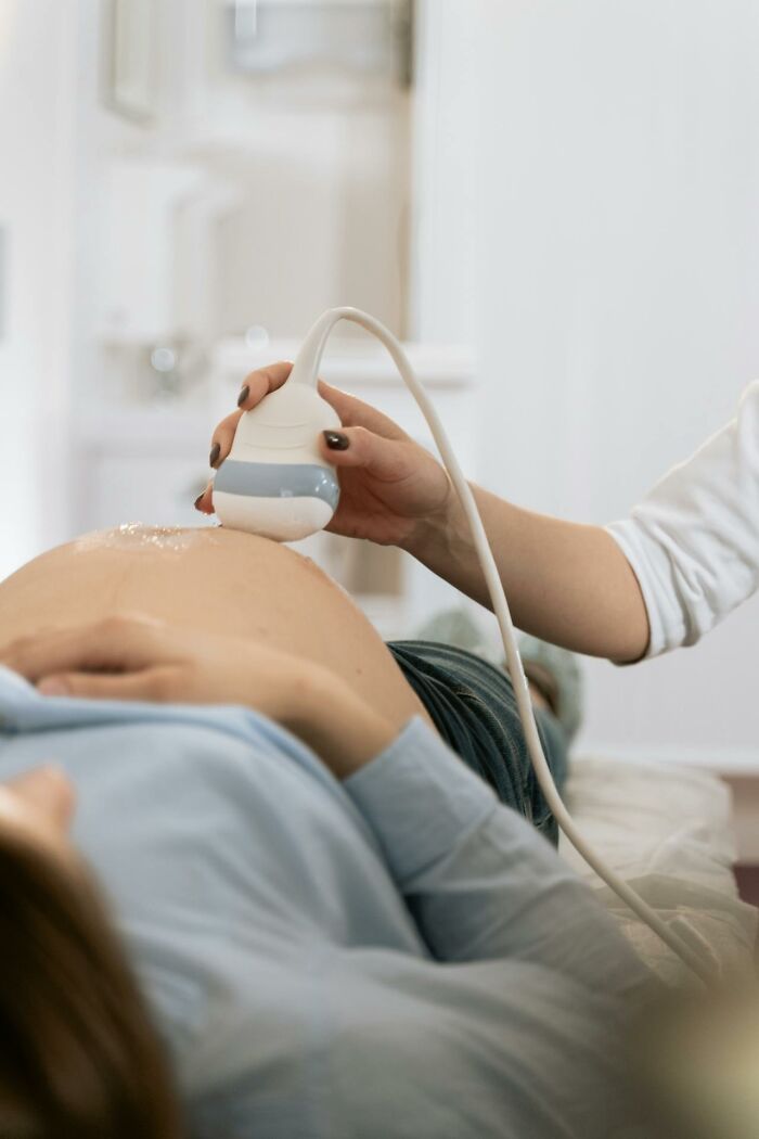 Pregnant woman receiving ultrasound scan as part of medical checkup among interesting and weird finds shared by doctors.