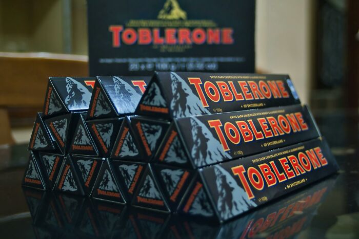 Stack of Toblerone chocolate bars arranged in a pyramid shape highlighting appalling facts people unaware might find surprising.
