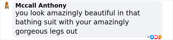 Sofia Vergara posing leggy in a plunging one-piece swimsuit, showcasing her stunning figure and style.