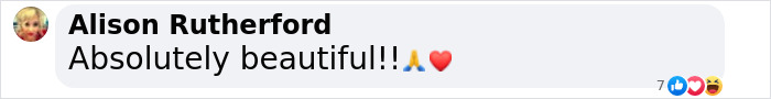 Comment text saying absolutely beautiful with praying hands and red heart emojis on a social media post.