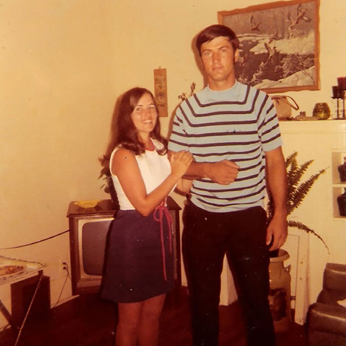 Vintage photo of a young couple in a living room, related to Duck Dynasty star Phil Robertson's health battle.