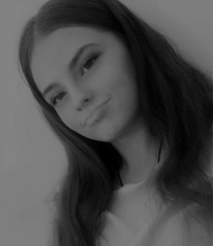 Teen girl with long dark hair in a black and white photo, related to final text of missing teen revealed. Teen girl with long dark hair in a black and white photo, related to final text of missing teen revealed.