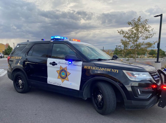 Police vehicle from Bernalillo County with lights on, related to incident involving boys in Minecraft and Star Wars pajamas. Police vehicle from Bernalillo County with lights on, related to incident involving boys in Minecraft and Star Wars pajamas.