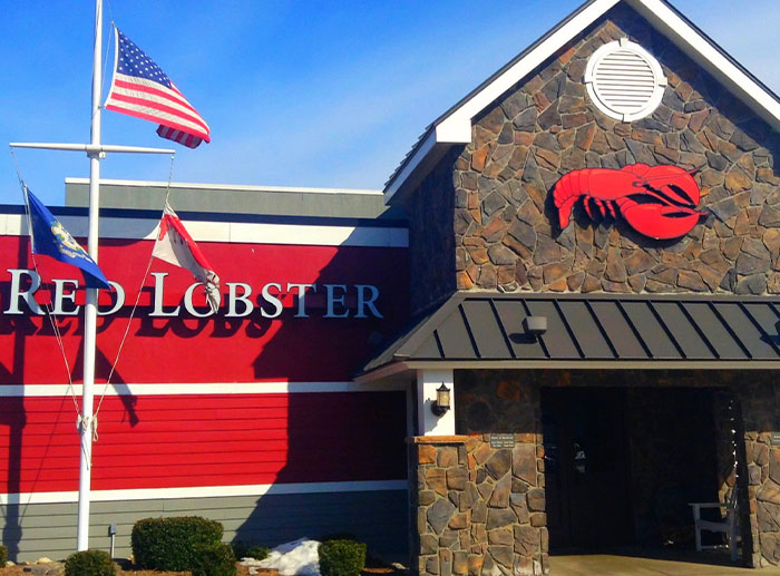 Red Lobster restaurant exterior with flags, representing a notable corporate and PR disaster in history.