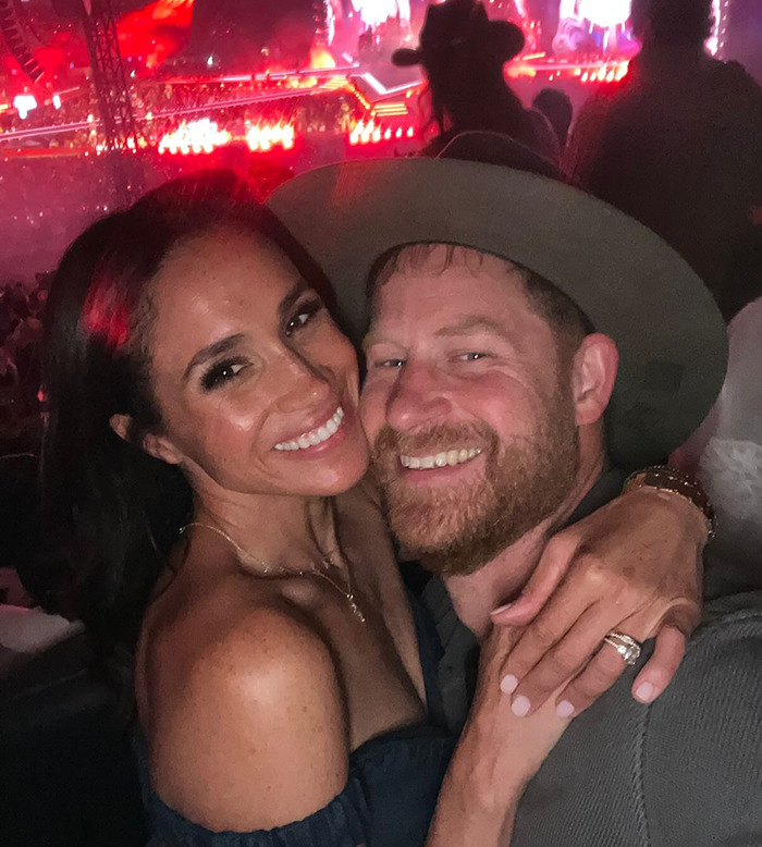 Prince Harry wearing cowboy hat with hidden symbols while sharing PDA with Meghan at a Beyoncé concert. Prince Harry wearing cowboy hat with hidden symbols while sharing PDA with Meghan at a Beyoncé concert.
