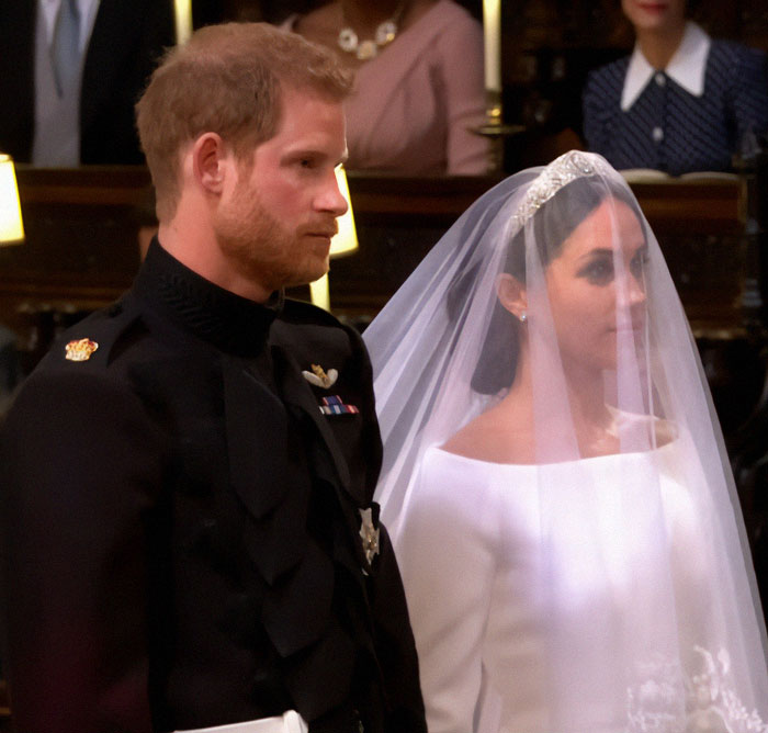 Prince Harry and Meghan Markle at wedding ceremony, highlighting Meghan Markle anniversary post controversy.