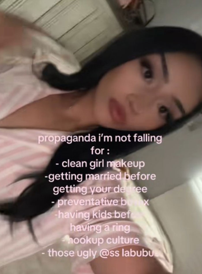 Young woman sharing a list of propaganda ideas she refuses to fall for, including makeup and societal expectations.