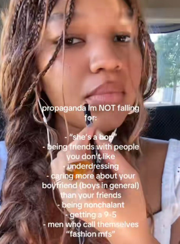 Young woman sharing common propaganda they refuse to fall for, focusing on social and friendship expectations.