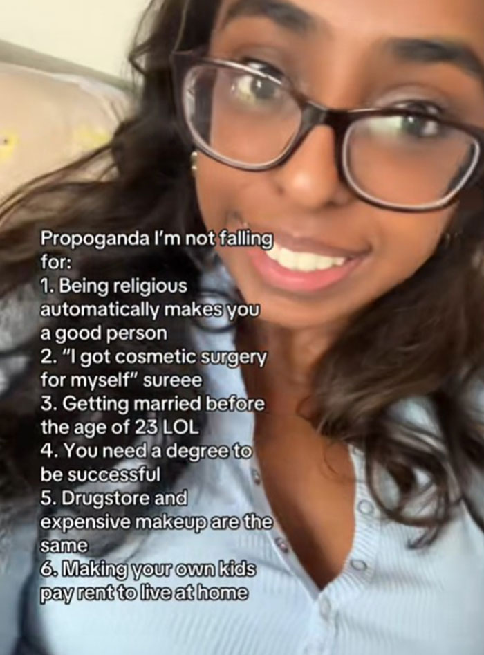 Young woman with glasses sharing common propaganda ideas she refuses to fall for, including success and relationships.