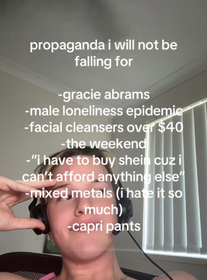 Person wearing headphones with a list of propaganda they refuse to fall for displayed in white text overlay.