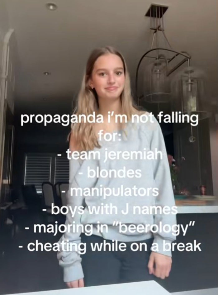 Young woman standing in a kitchen with text listing propaganda she refuses to fall for including manipulators and cheating.