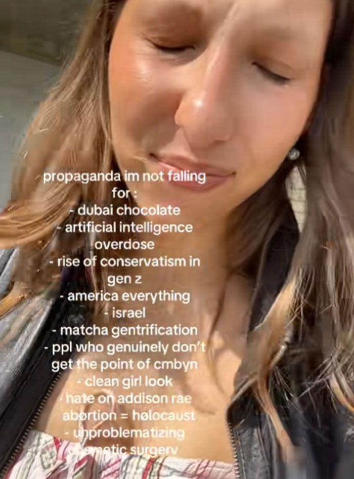 Young woman with eyes closed listing propaganda she refuses to fall for including artificial intelligence o******e and matcha gentrification.