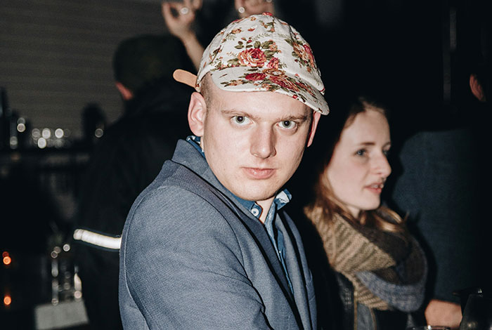 Young man and woman at a social event, highlighting emotional expressions related to siblings of narcissists and sociopaths.