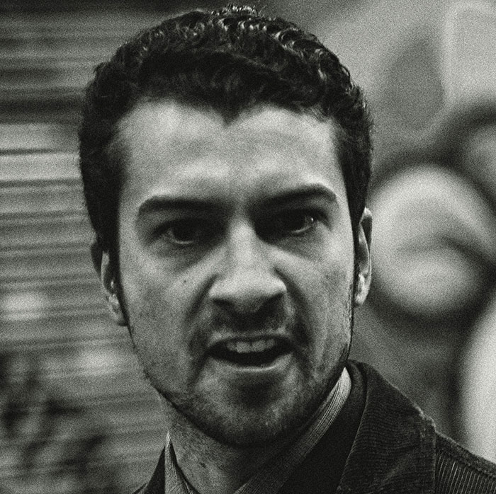 Angry man with intense expression, representing the emotional impact of siblings of narcissists and sociopaths.