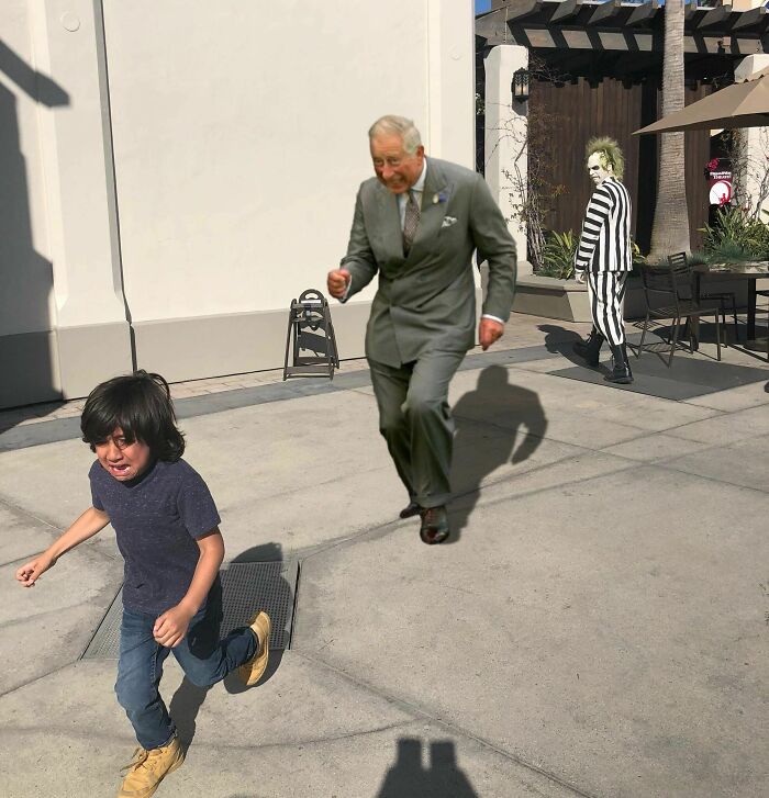 Boy running away from a photoshopped man in a suit and a striped character in the background showing hilarious Photoshop skills.
