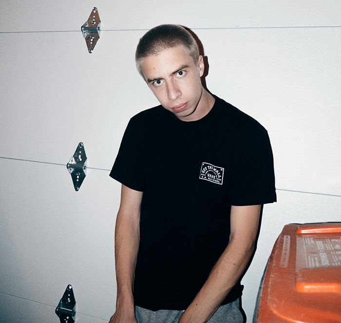 Young man in a black shirt posing indoors, illustrating moments when people took huge risks for no logical reason.