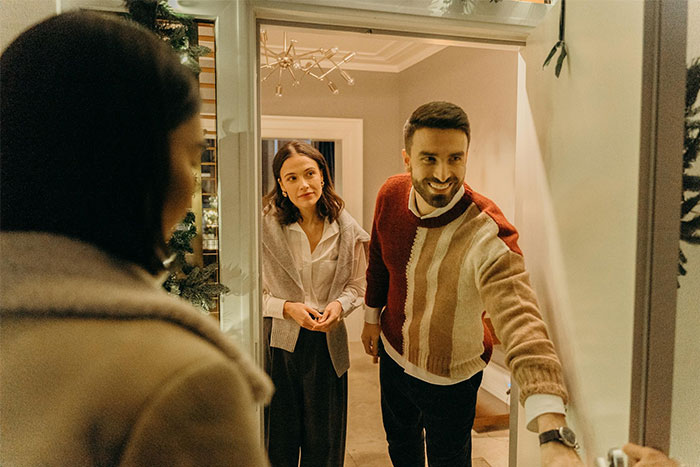 Highly sensitive sister-in-law hesitates at the door as her high demands cause tension during a family gathering. Highly sensitive sister-in-law hesitates at the door as her high demands cause tension during a family gathering.
