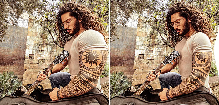 Man with curly hair and tattoos holding guitar in outdoor setting, example of influencers using heavy editing on Instagram posts.