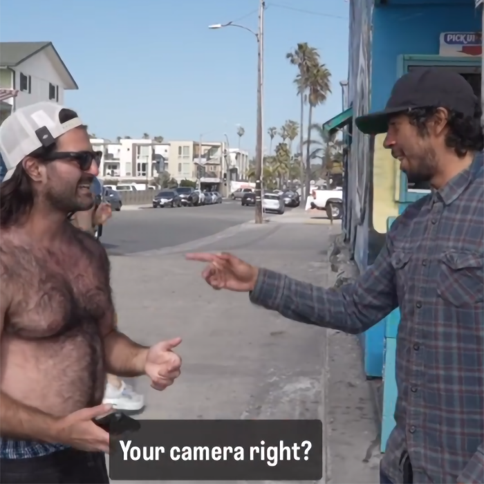Man confronting creepy influencer wearing smart glasses while filming woman secretly on busy street. Man confronting creepy influencer wearing smart glasses while filming woman secretly on busy street.