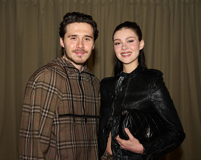 Romeo and Cruz Beckham posing together at an event amid Instagram family drama involving sister-in-law Nicola Peltz.