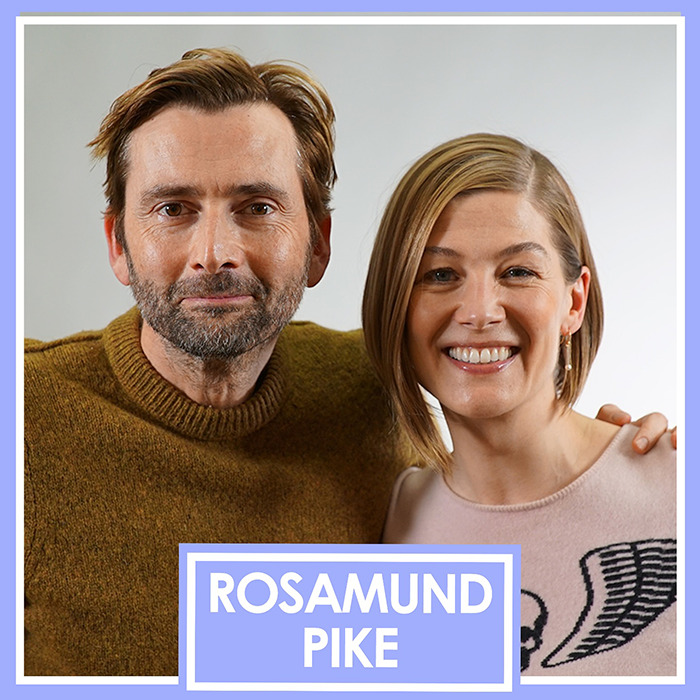 Rosamund Pike and a man smiling closely together in a casual setting discussing Bond girl auditions and claims