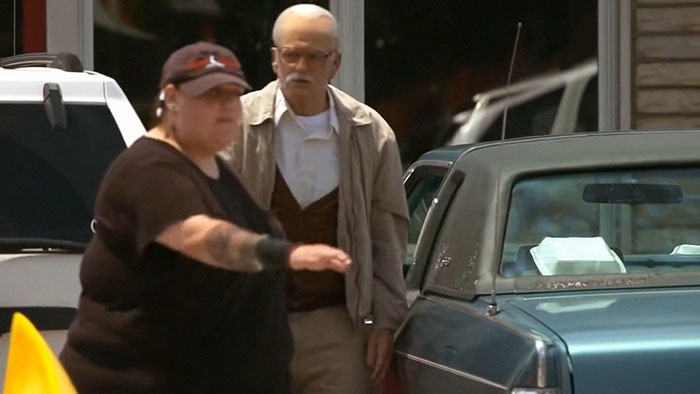 Two people near a parked car, illustrating confidence and interaction for comebacks to entitled bosses.