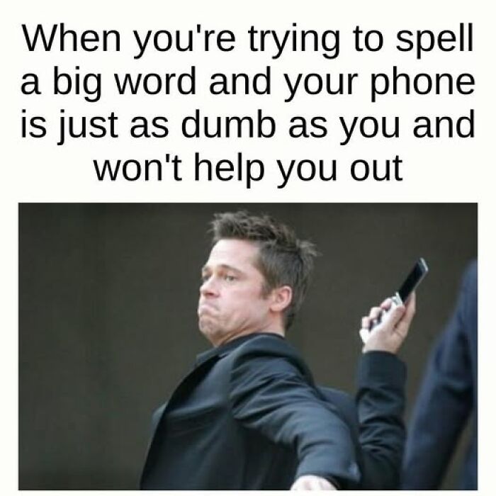 Man making a frustrated face while holding a phone, illustrating sarcastic meme about phone not helping with spelling.