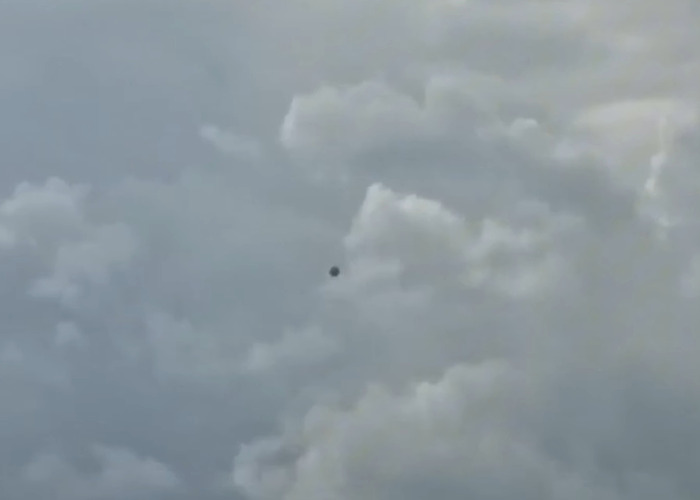 Dark UFO with ominous writing appears in cloudy sky, prompting scientists to break silence on origin of birth mystery.