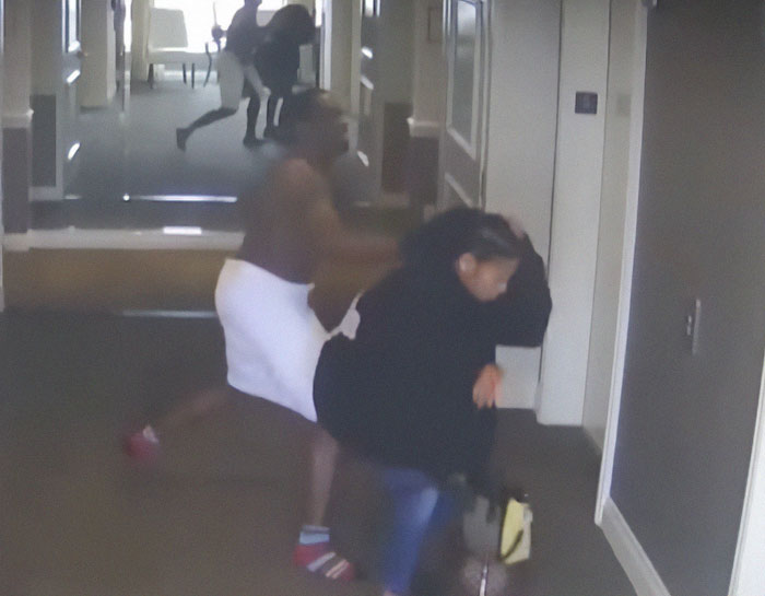 Photo showing Diddy in a hallway preparing intensely for Freak Off with others captured in the background Photo showing Diddy in a hallway preparing intensely for Freak Off with others captured in the background