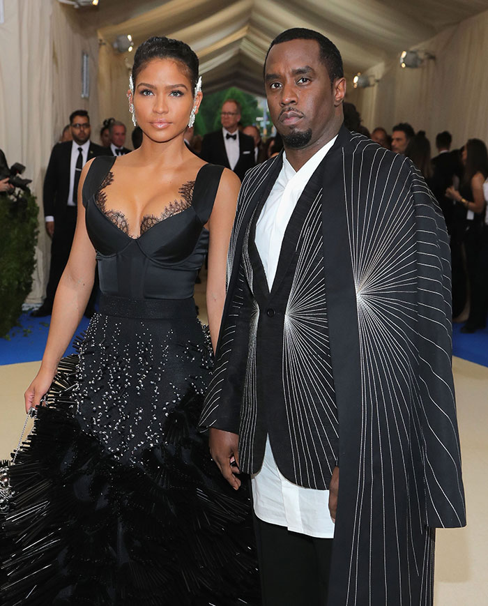 Cassie and Diddy dressed formally at an event, related to Cassie describing freak-offs in graphic detail.