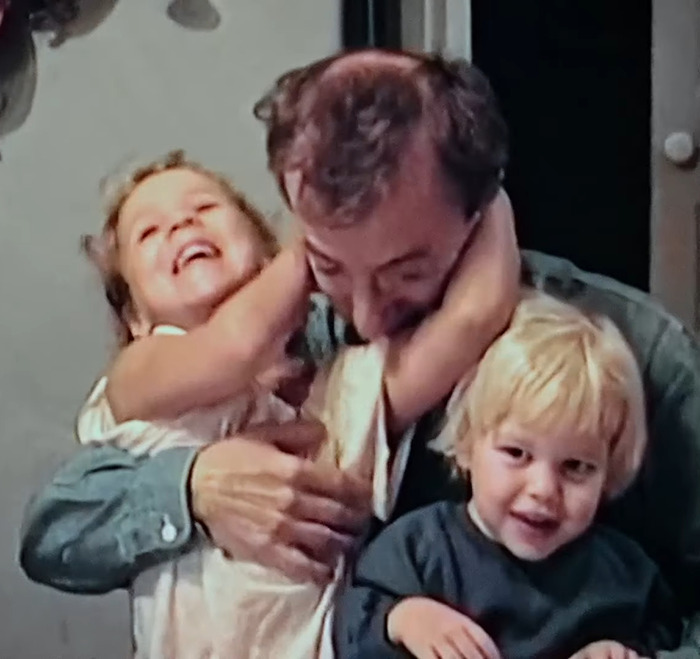 Sean Penn with two young children, showing a tender family moment amid discussions of his rough appearance and Woody Allen claims.