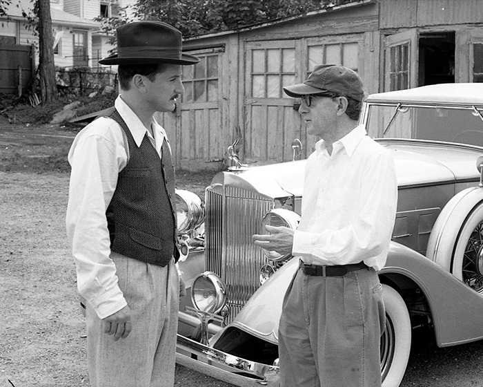 Sean Penn with a rough appearance talking to a man in front of a vintage car, fans alarmed by his heavy claims about Woody Allen.