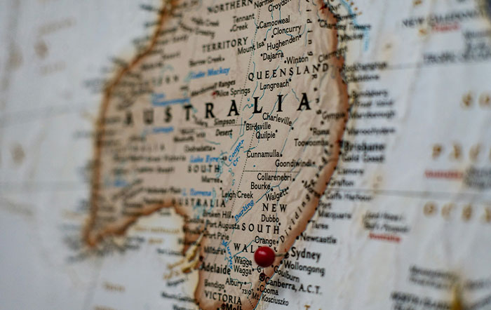 Close-up of a map of Australia with a red pin marking a location, illustrating moments of unexpected stupidity.