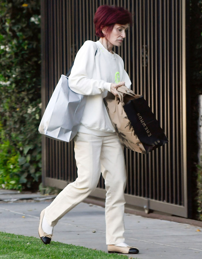 Sharon Osbourne carrying shopping bags outdoors, showing slim appearance linked to Ozempic preventing weight gain. Sharon Osbourne carrying shopping bags outdoors, showing slim appearance linked to Ozempic preventing weight gain.